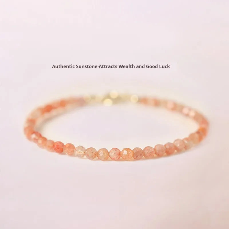 Women's ultra-thin 3mm Sunstone bead bracelet on wrist, showing natural crystal and delicate design.