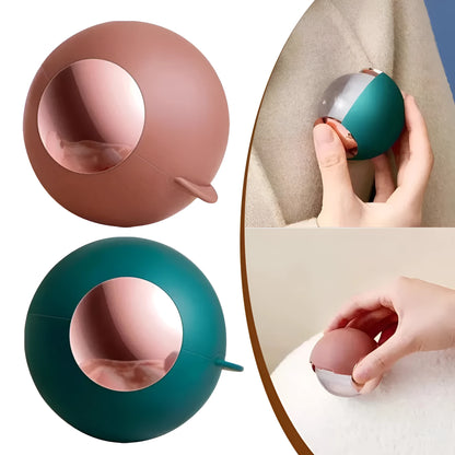 Reusable gel lint roller ball in green gold colour for removing pet hair and lint from fabrics.