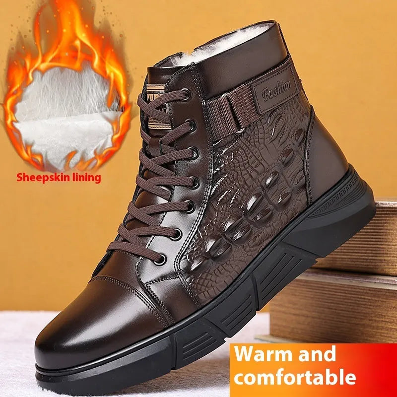 Men's brown genuine leather lace-up snow boots with fur lining and deep-tread rubber sole on a wooden surface.