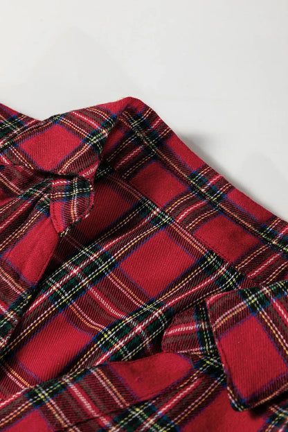 Red plaid mini dress with shirt collar, half buttons, long sleeves, and ruffle hem