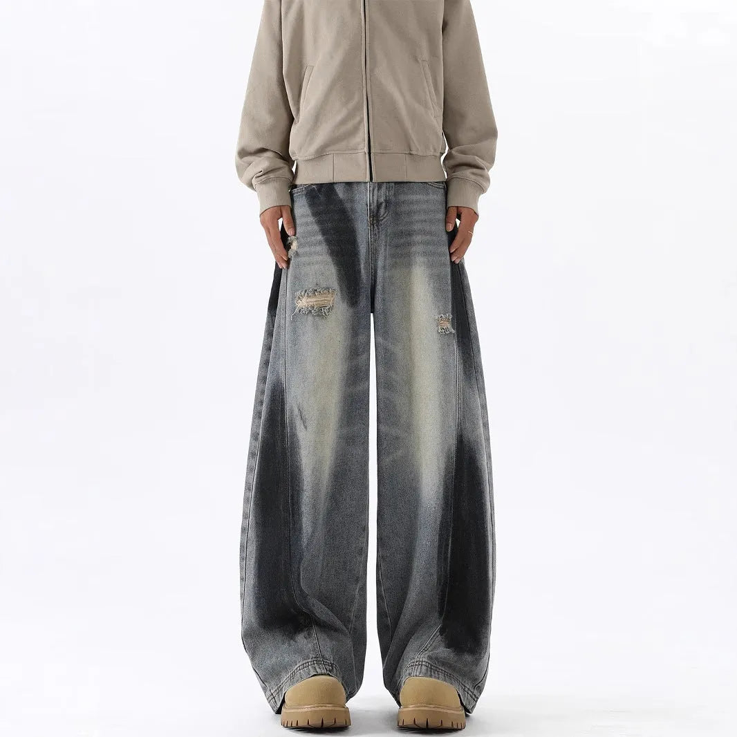 Men's blue ripped jeans with splash-ink distressing and loose fit