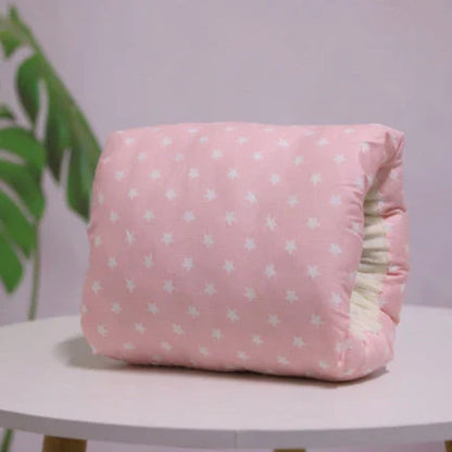 Adjustable nursing pillow with various color options, designed to provide comfort and support for breastfeeding mothers
