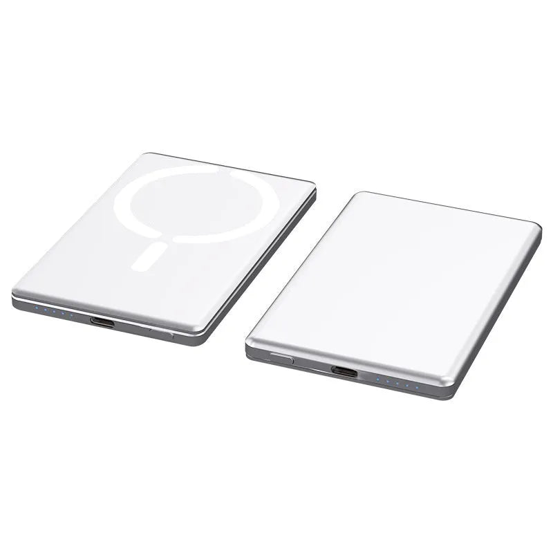 Slim dark grey magnetic power bank attached to the back of an iPhone, showing its thin profile and metallic finish.