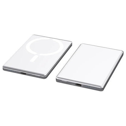 Slim dark grey magnetic power bank attached to the back of an iPhone, showing its thin profile and metallic finish.