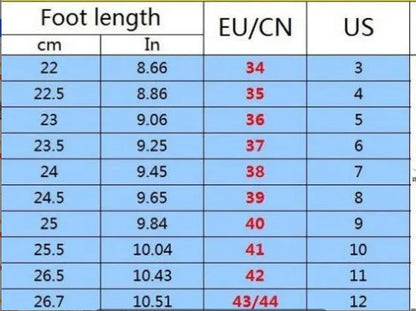 Women's black and white low-top casual running sneakers with round toe and MD soles