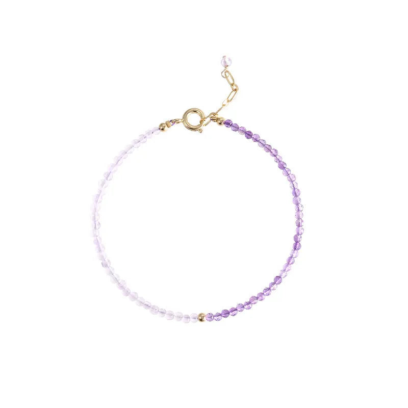Women's geometric crystal bracelet with cut facets and spherical sections in 2mm purple rattan style.