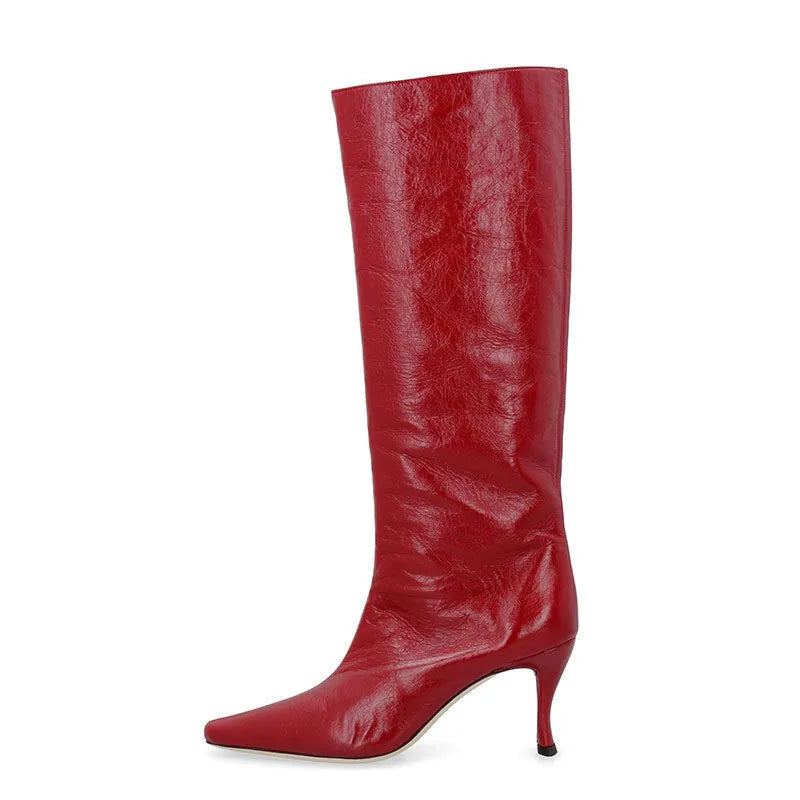 A pair of women's black square-toe cowboy boots made from microfiber leather.