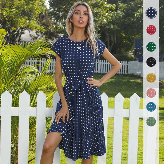 A classic polka dot midi dress with a buttoned style, perfect for summertime