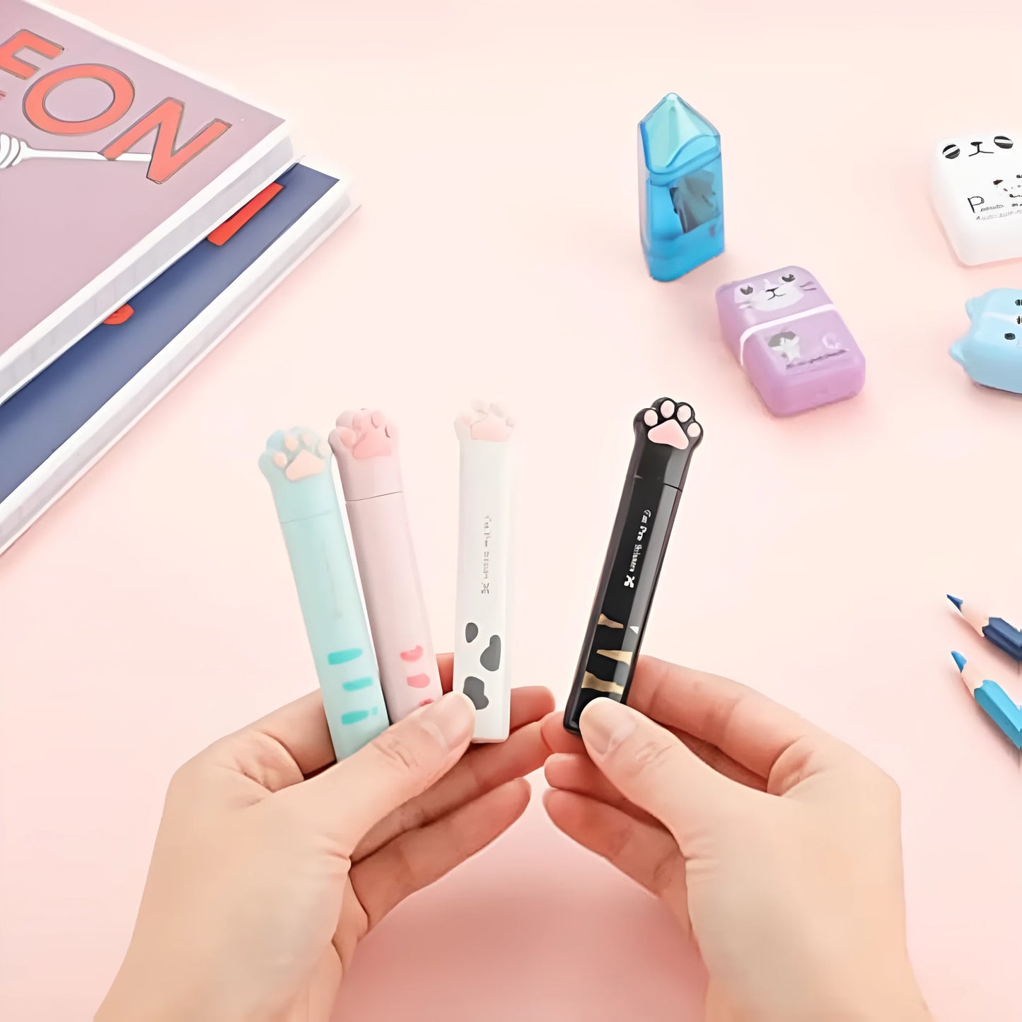 Closed cat paw design mini folding scissors showing safety lock, in choice of colours.