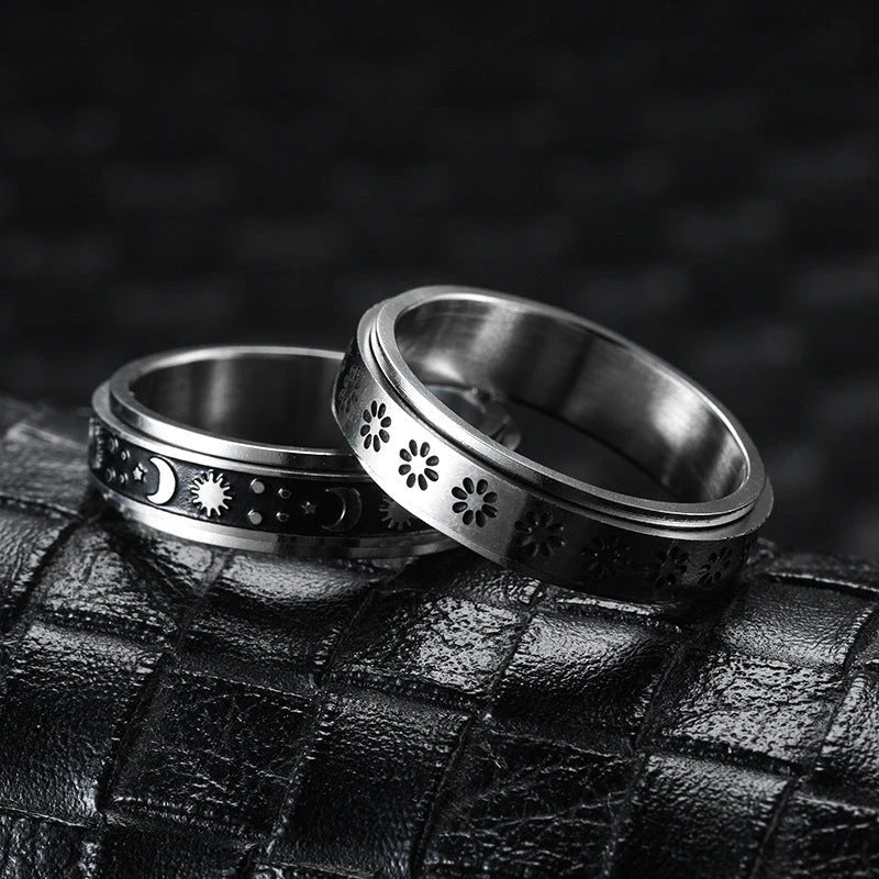 Rotatable stainless steel spinner ring with moon and star designs for anxiety relief and style