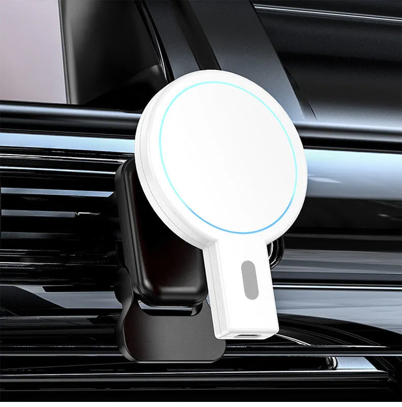 White magnetic wireless charger on a wooden desk next to a smartphone showing the secure magnetic attachment.