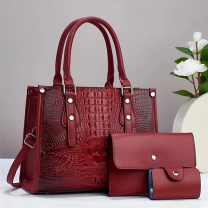 Contrast colour three-piece bag set showing bucket-shaped crossbody bag, wallet, and card holder in coordinated colours