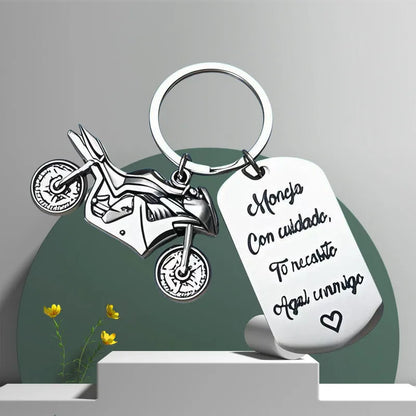 Stainless steel motorcycle-themed keychain with modern design and protective flannel bag