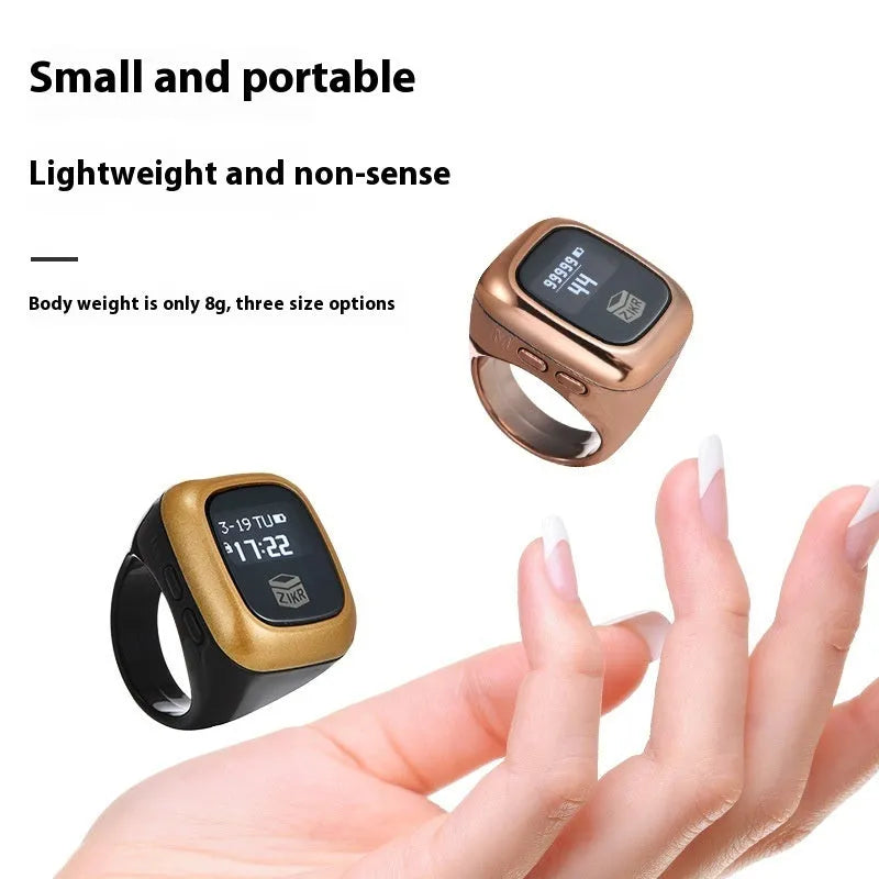 Al-Fatiha black digital wrist counter with display screen showing numbers, on a wrist.