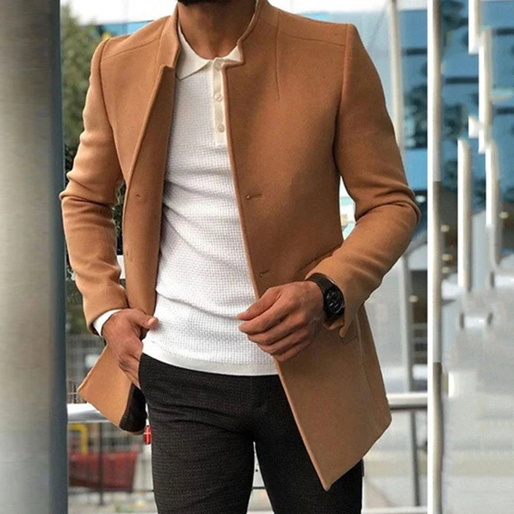 A single-breasted wool-blend coat in various colours, showcasing a tailored silhouette and premium British craftsmanship.