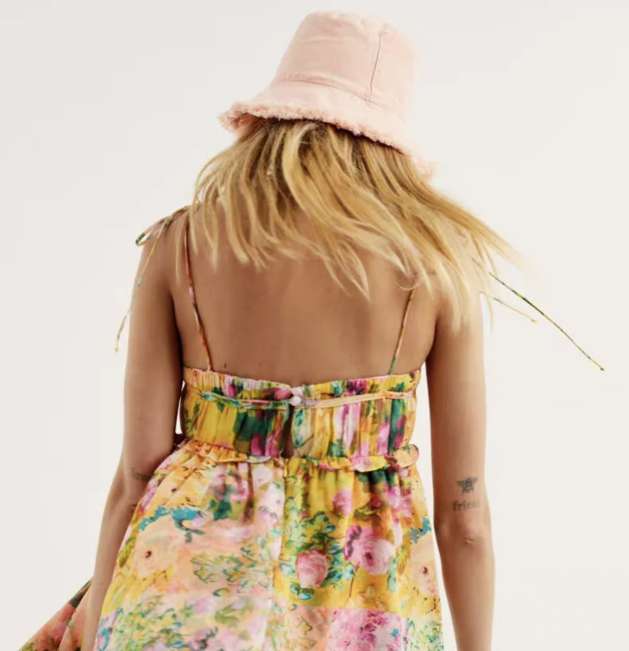 Stylish floral print suspender dress with ruffled A-line skirt and adjustable spaghetti straps for a customized fit