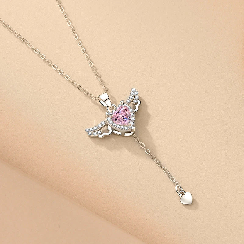 Elegant angel wings necklace with moving heart pendant, made of titanium steel and crystal accents