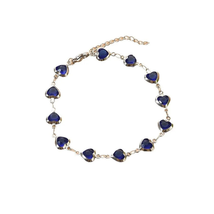 Devil's eye geometric heart bracelet in stainless steel showing colourful electroplated finish options.