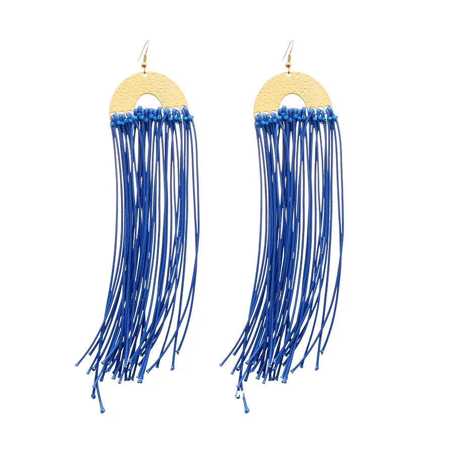 Handmade geometric women's earrings with blue resin flower and cloth material on silver needle setting.