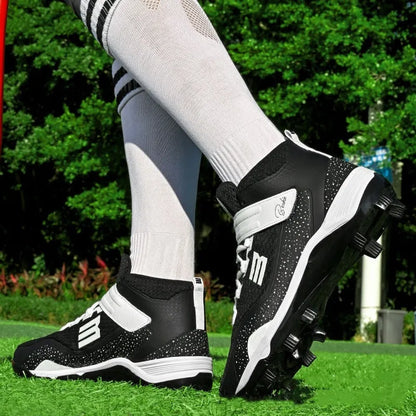 Black and white mid-top baseball sneakers with Velcro strap on a grass surface