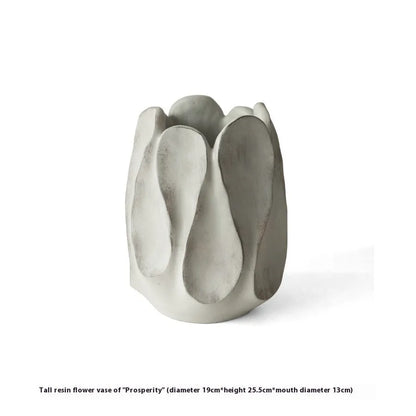 Hand-formed irregular ceramic vase measuring 25cm tall with 15cm diameter opening, made from magnesium clay