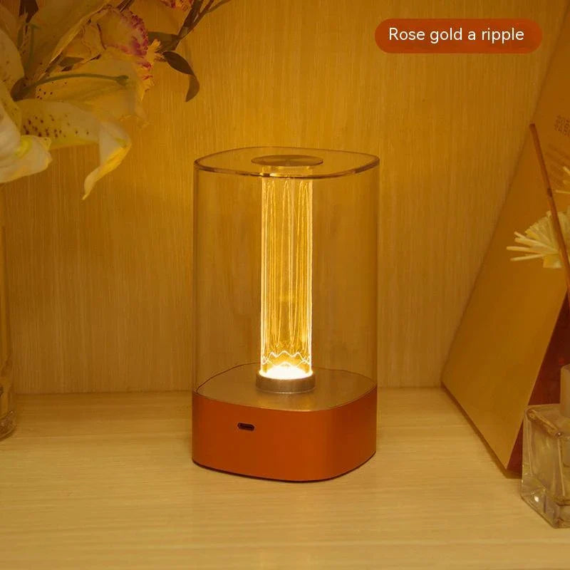Elegant touch-controlled bedside lamp with soft, warm lighting, unique lamp post design, and wireless USB charging
