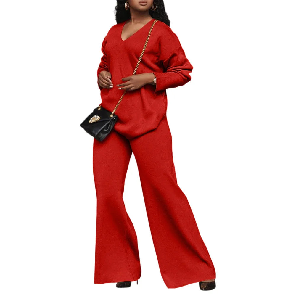 Women's brown suede two-piece suit with split sleeves on top and matching trousers