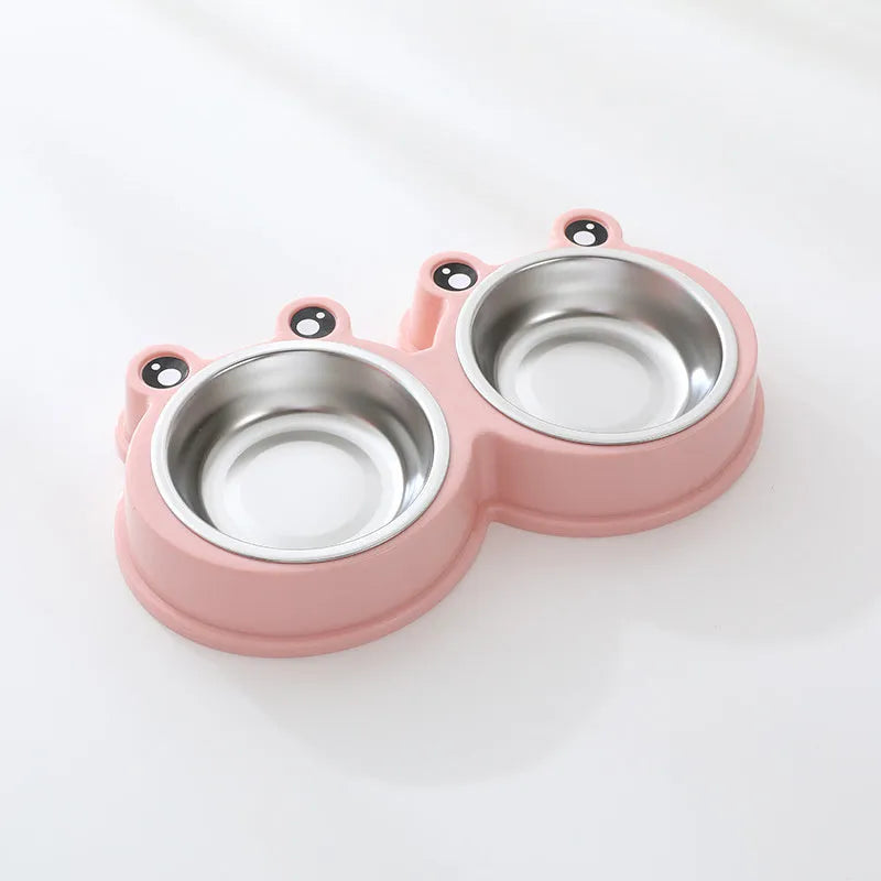 Stainless steel pet bowl with frog design and two compartments for food and water.