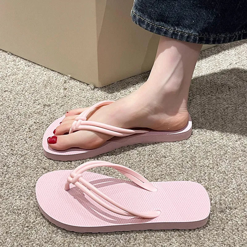 Men's PVC toe-covering flip-flop slippers on a white background, showing the injection moulded sole and available colour options.
