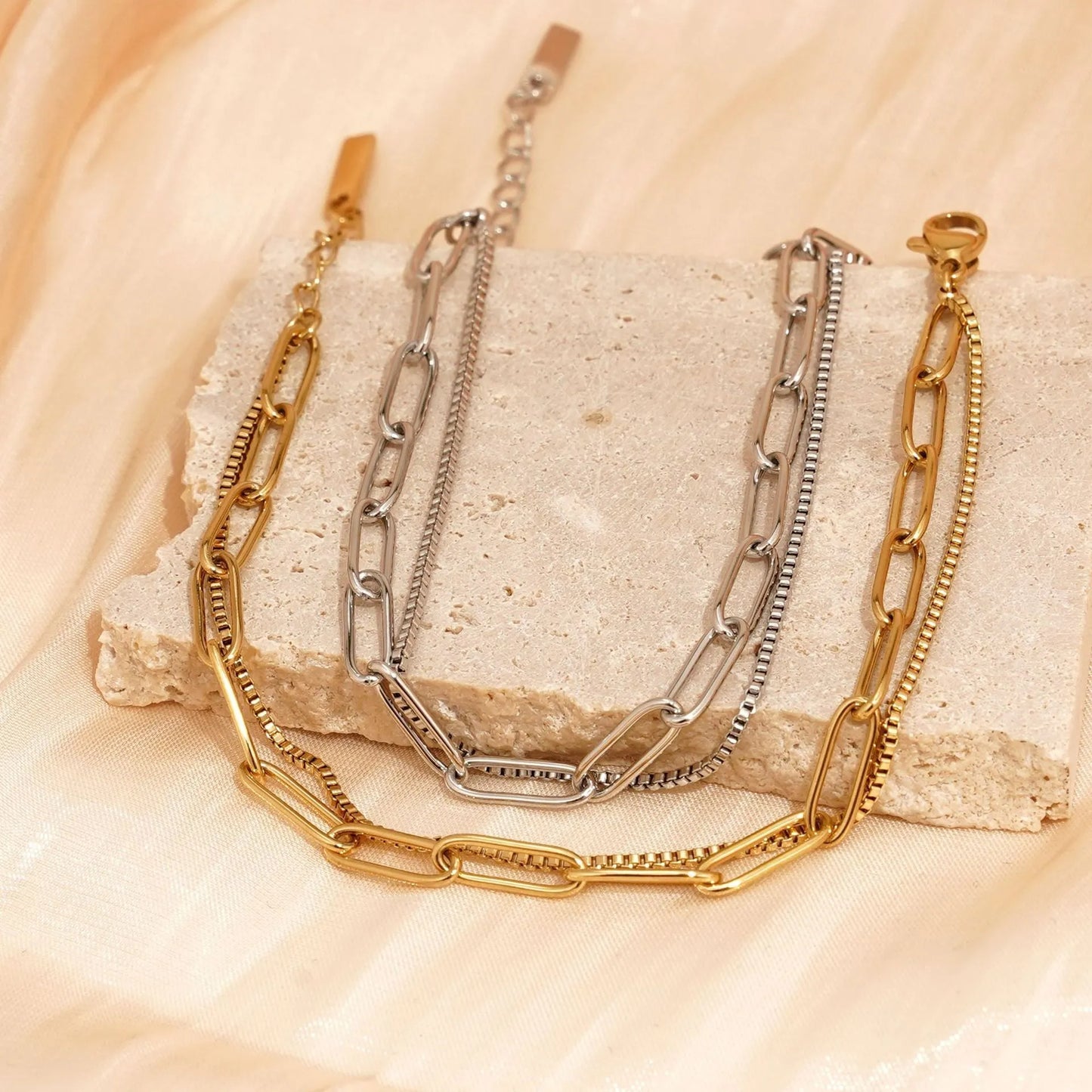 Double layer geometric women's bracelet in gold or silver electroplated finish with linear design elements