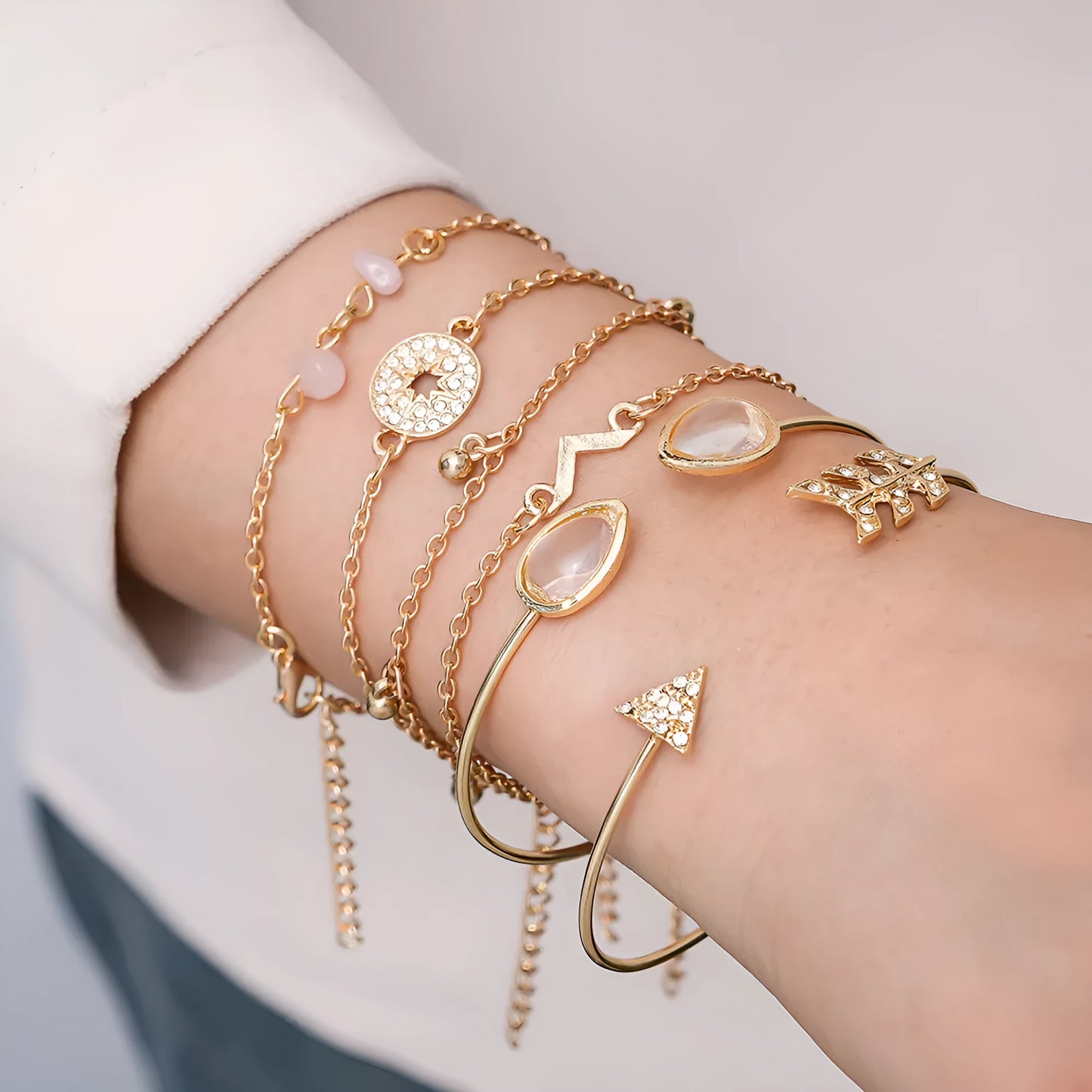 Six golden spot drill bracelets with arrow, water drop and V-shaped pendants on zinc alloy chains