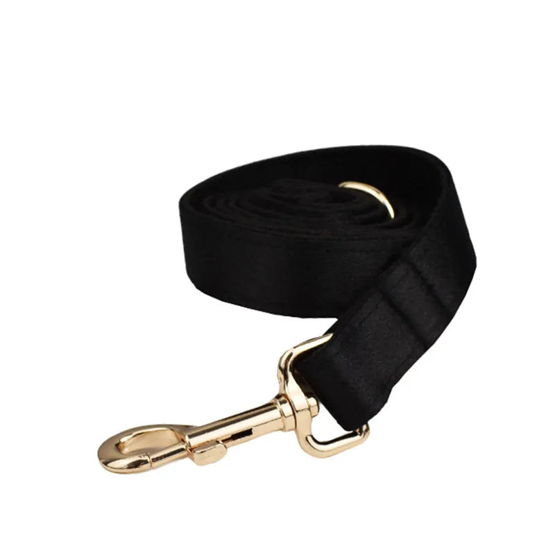 Cloth dog collar and leash set with chest strap harness, adjustable vest, and decorative bow.
