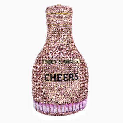 Gold hard-shell clutch bag shaped like a champagne bottle with a synthetic leather interior.