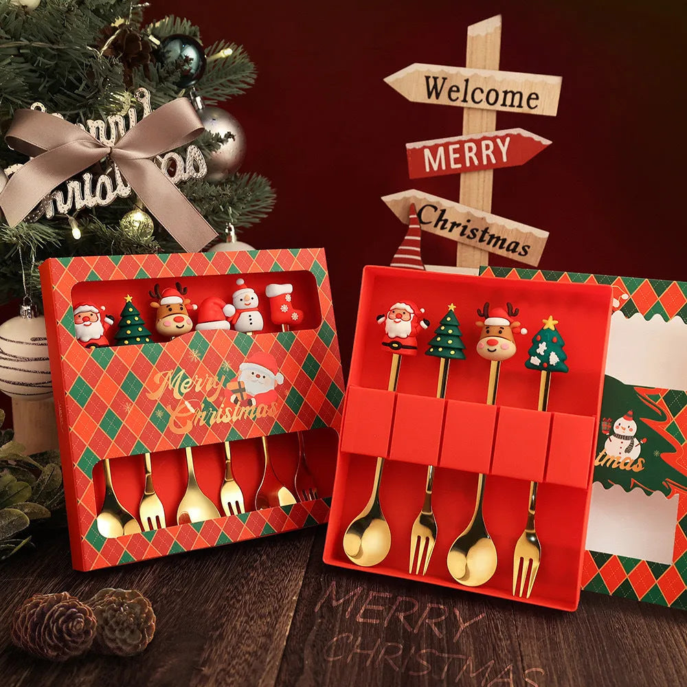 Red-handled stainless steel Christmas spoons and forks with snowman and tree designs.
