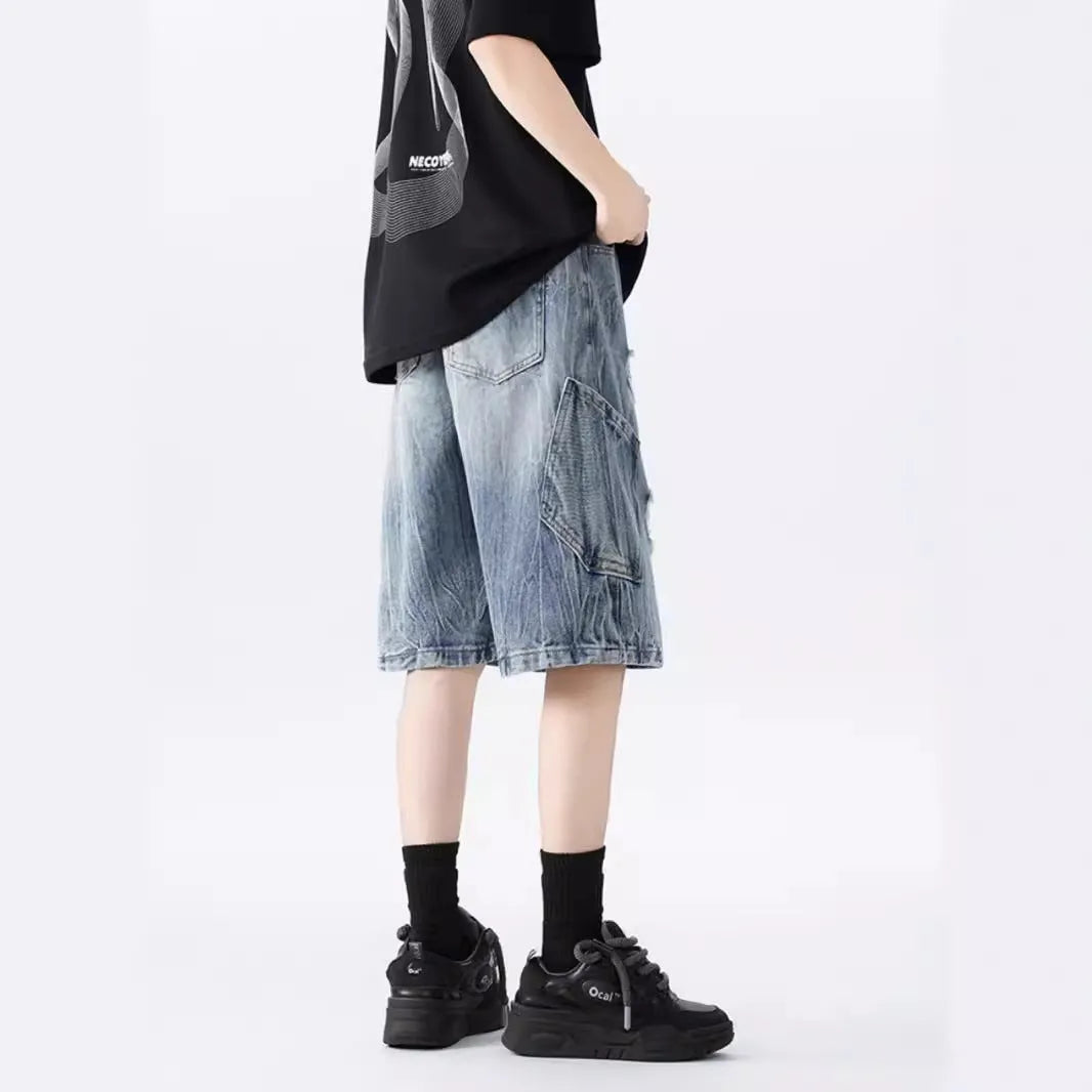 Mens loose fit ripped denim shorts in washed blue and black retro style