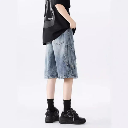 Mens loose fit ripped denim shorts in washed blue and black retro style