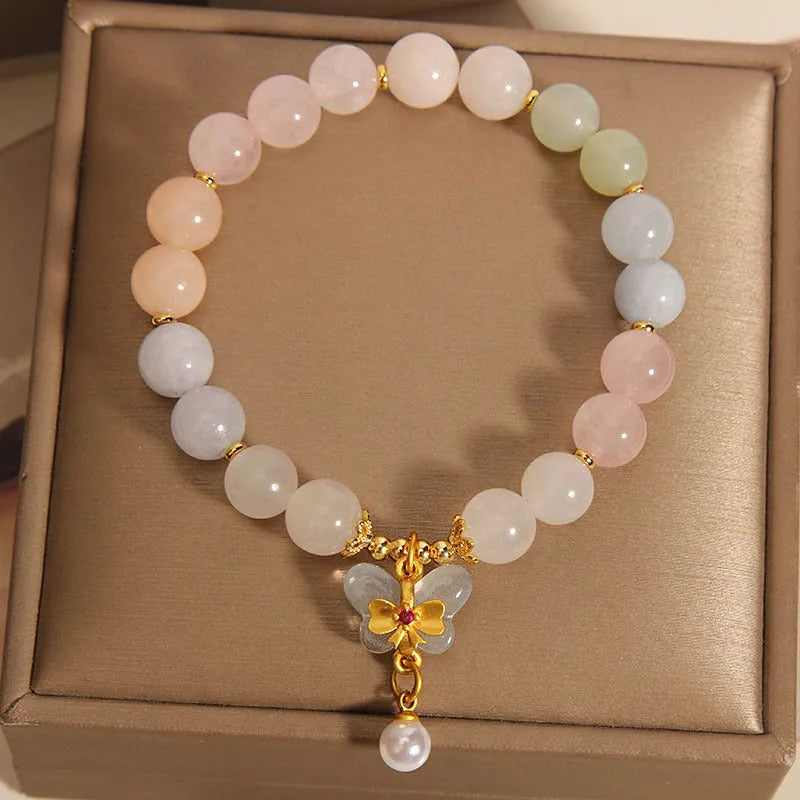 Original design women's bracelet with colourful morganite butterfly pendant made from crystal and jade.