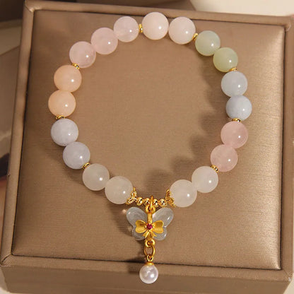 Original design women's bracelet with colourful morganite butterfly pendant made from crystal and jade.
