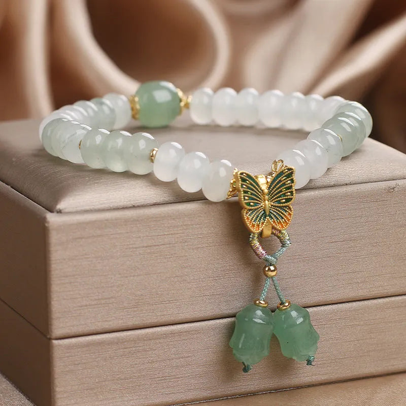 Green crystal abacus beads bracelet with retro butterfly charm and tassel decoration