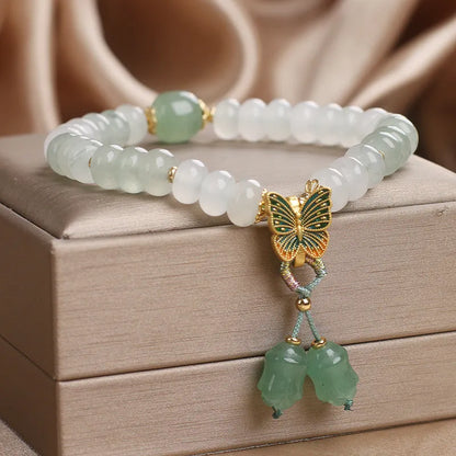 Green crystal abacus beads bracelet with retro butterfly charm and tassel decoration