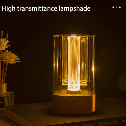 Elegant touch-controlled bedside lamp with soft, warm lighting, unique lamp post design, and wireless USB charging