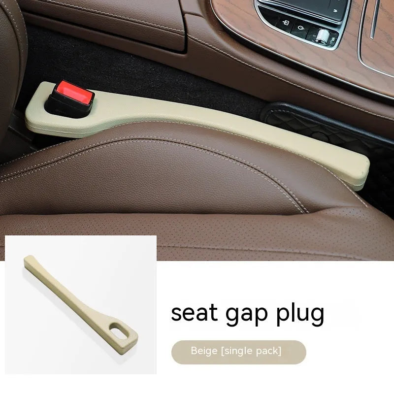 Polyurethane car seat gap filler strip in assorted colours on a car seat.