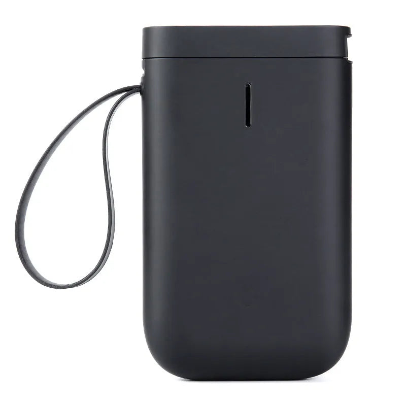 D11 black Bluetooth thermal label printer on a desk next to a smartphone showing the label design app