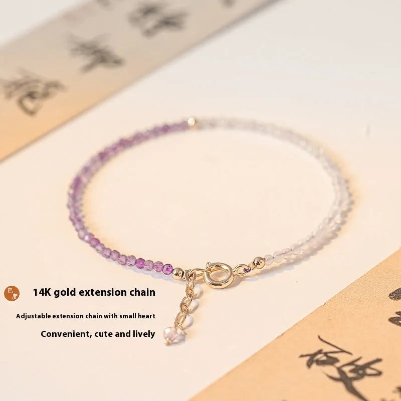 Women's geometric crystal bracelet with cut facets and spherical sections in 2mm purple rattan style.