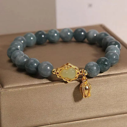 Women's natural stone bracelet with sky blue carved gourd and lotus pendant