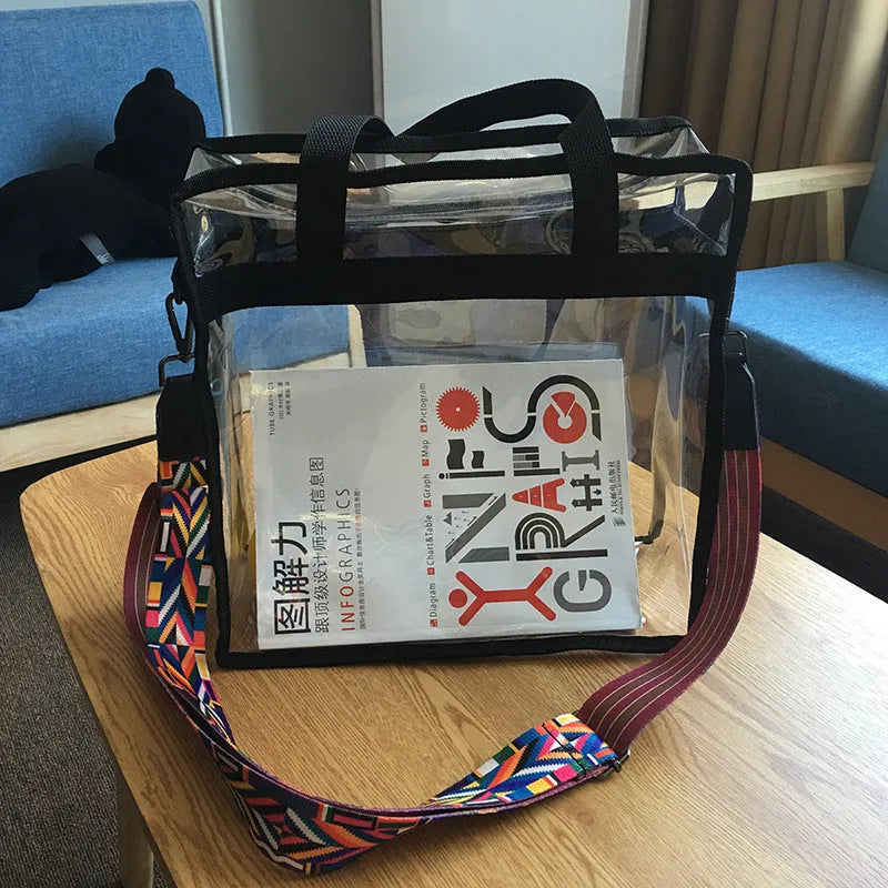 Clear PVC women's messenger bag with a coloured front panel and double shoulder straps.