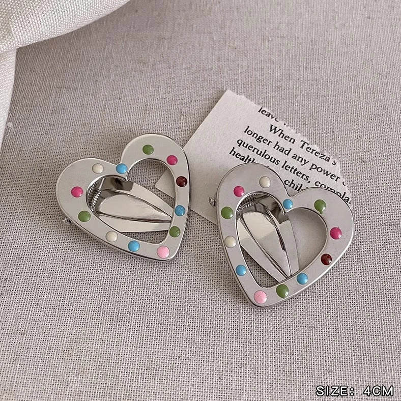 Silver metal hair barrettes with hollow heart pattern and duckbill clip design