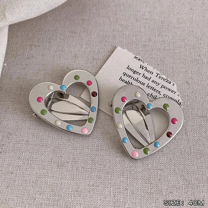 Silver metal hair barrettes with hollow heart pattern and duckbill clip design
