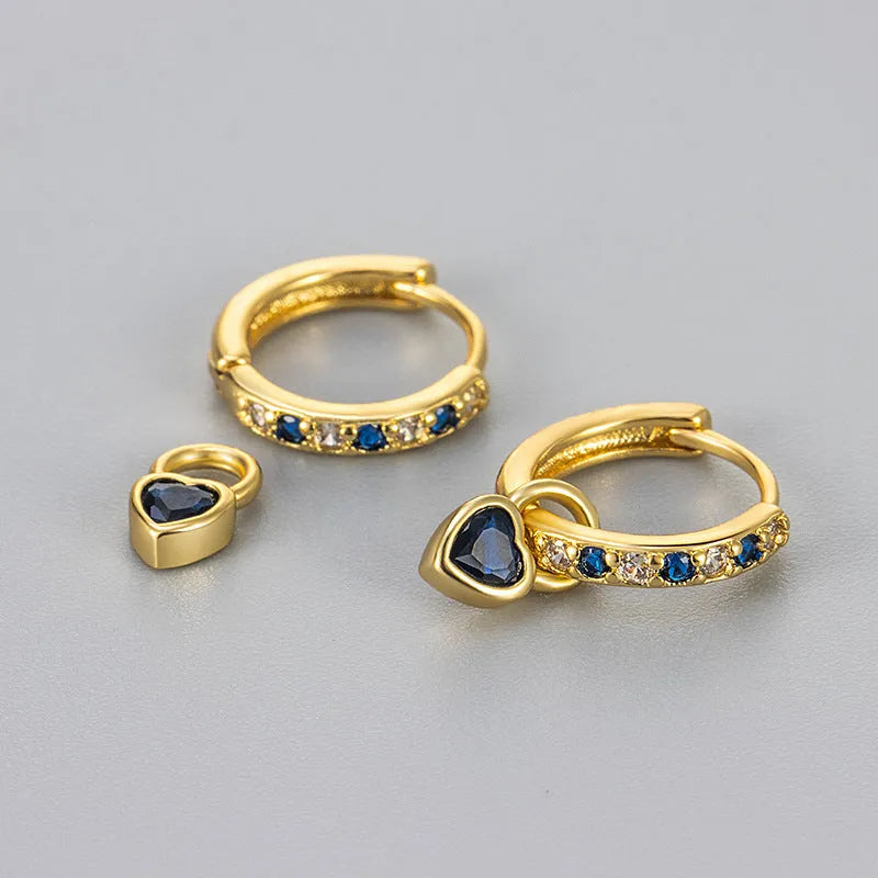 Women's fashion earrings with heart-shaped eardrops, diamond-treated gemstones in gold or white gold plating, approximately 2.5 cm long