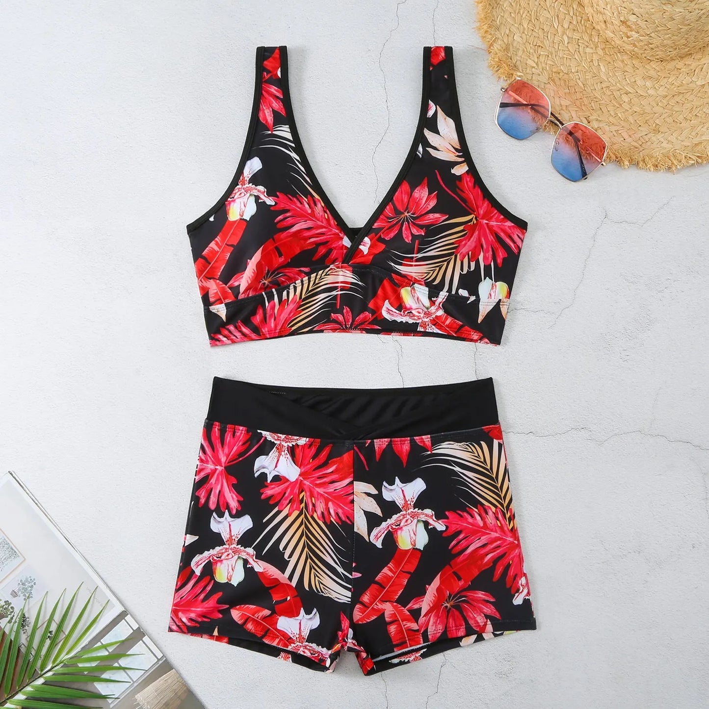 Women's two-piece swimsuit set showing sleeveless bikini top and printed boxer-style briefs in a multi-colour pattern.